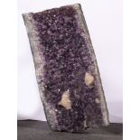 A large concave Amethyst multi-crystal specimen, 67cm x 33cm, having other white quartz crystals,