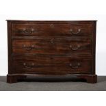 A George III mahogany serpentine chest of drawers, fitted with three deep long drawers,