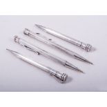 Two pairs of silver Eversharp pencils, one pair having plain polished hexagonal barrels, 10cm long,