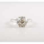 A diamond solitaire ring, the Edwardian brilliant cut stone,