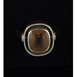 Tom Payne and Peter Triggs - a citrine dress ring, the cushion shaped step cut stone, 10mm x 9.