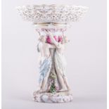 A Meissen porcelain comport, modelled with the three Graces, pierced shallow bowl,