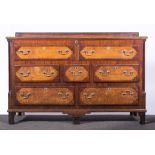 A George III oak and mahogany Lancashire type mule chest, banded outlines, hinged top,