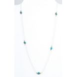 A necklace of seed pearls, spaced by five cage set turquoise matrix, approximately 7mm,