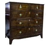 A George IV mahogany bow-front chest of drawers fitted with two short and three long drawers,