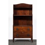 A Regency style mahogany waterfall bookcase, with two drawers below and on square tapering legs,