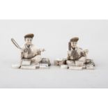 Two Japanese carved ivory Okimonos, probably Meiji, modelled as seated craftsman, one with a saw,