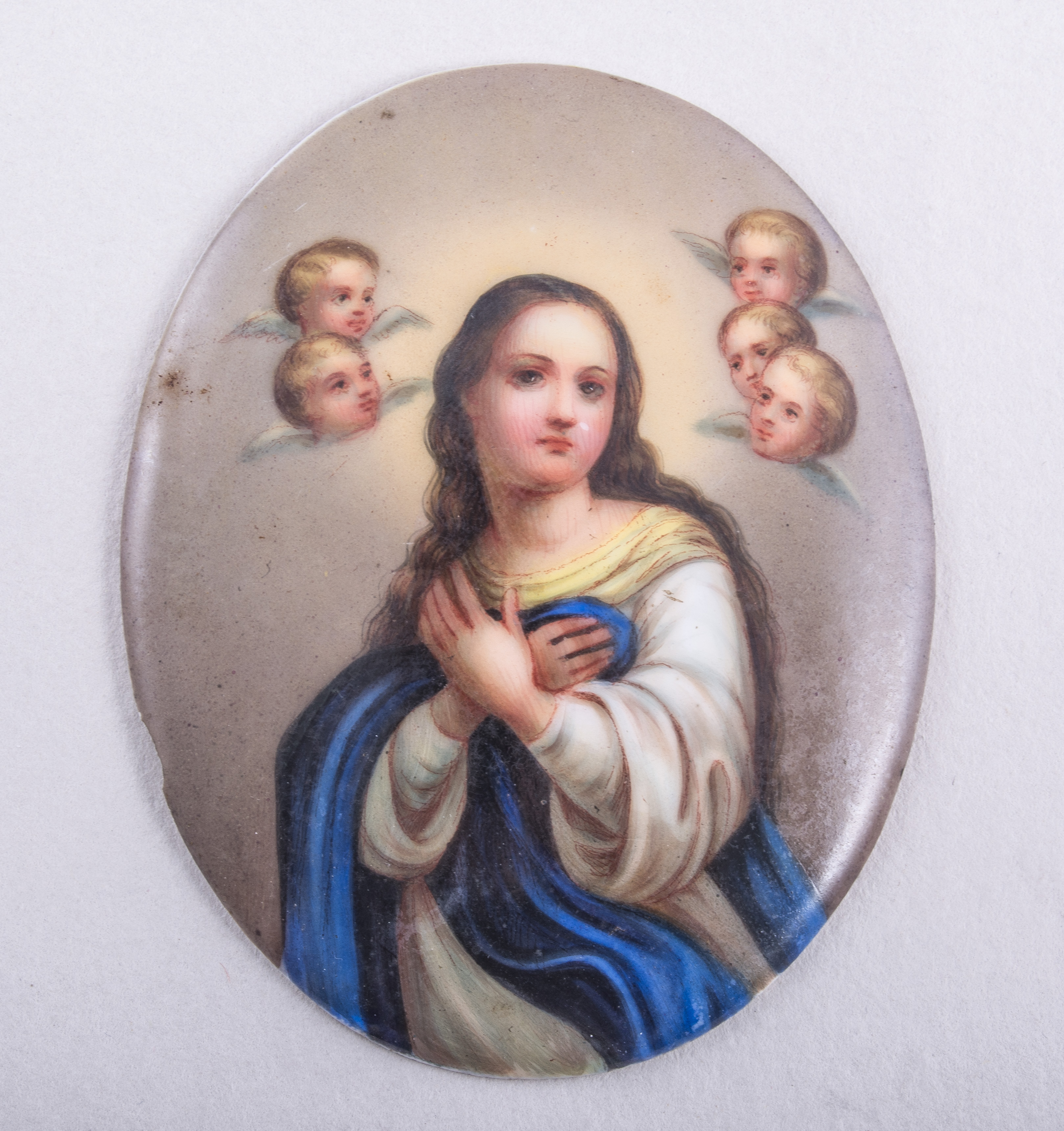 A pair German porcelain plaques, Virgin Annunciate with cherubim and St Joseph with Christ Child,