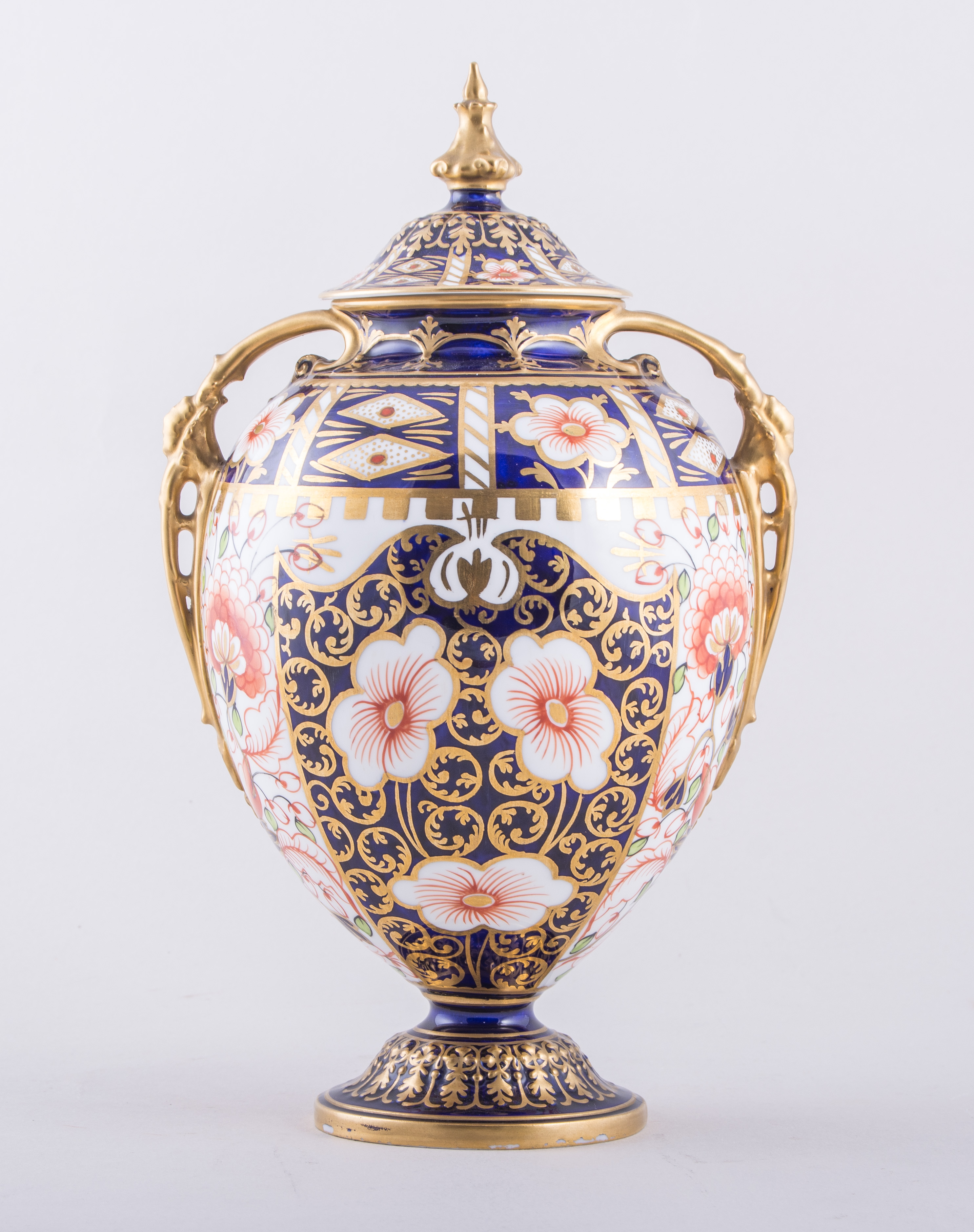 A Royal Crown Derby bone china two handled ovoid pedestal covered vase, 1902, Witches pattern,