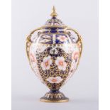 A Royal Crown Derby bone china two handled ovoid pedestal covered vase, 1902, Witches pattern,