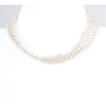 A three row cultured pearl choker necklace,