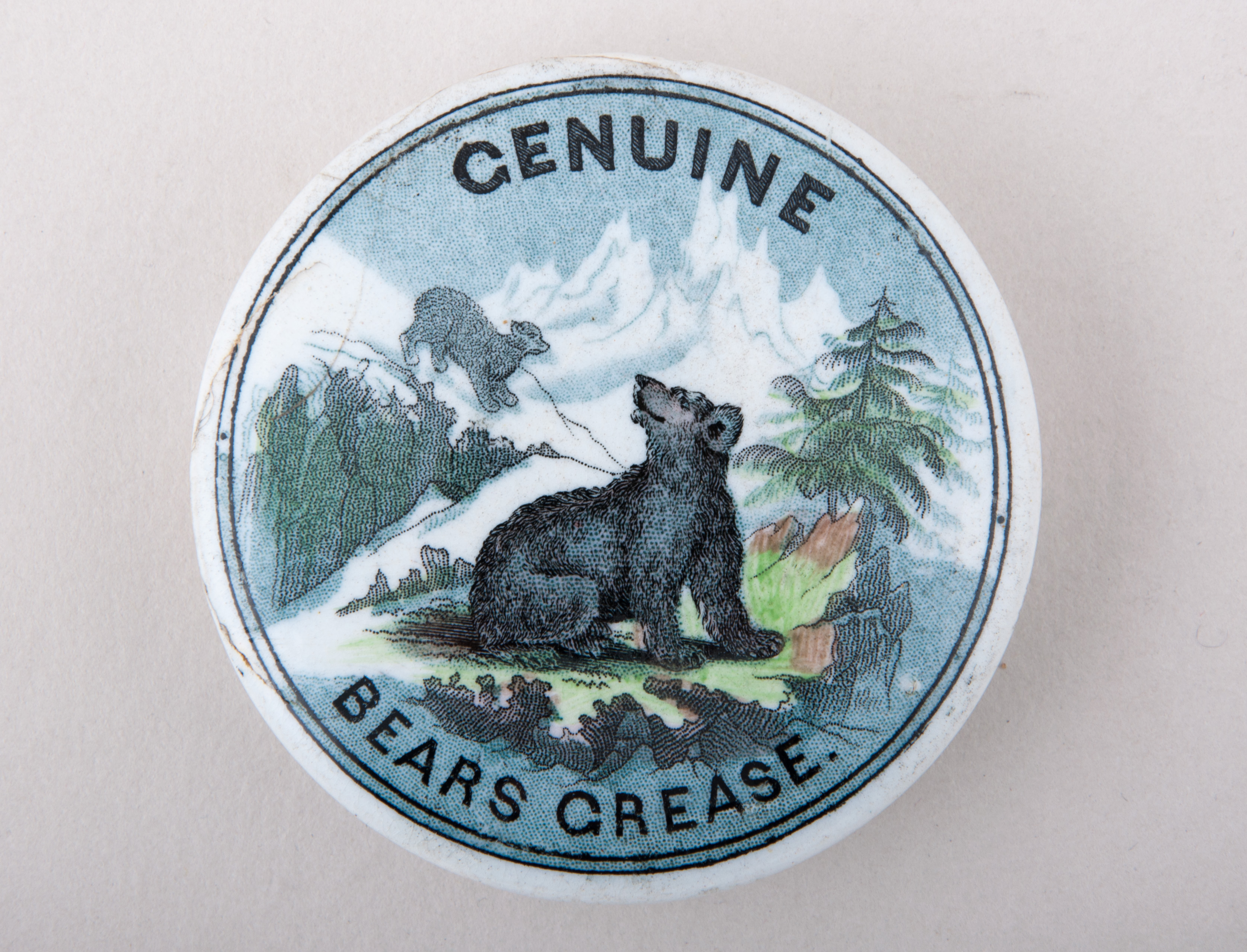 A very rare Prattware pot lid, GENUINE BEARS GREASE, hairline cracks and repairs, diameter 7.