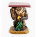 A Minton and Co Majolica Monkey seat, 1872, modelled as a crouching monkey holding a coconut,