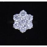 A seven stone diamond cluster ring,