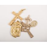 Five yellow metal pendants, the head of Christ stamped 18ct, approximate weight 2.