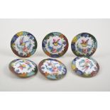 Set of six enamelled buttons.