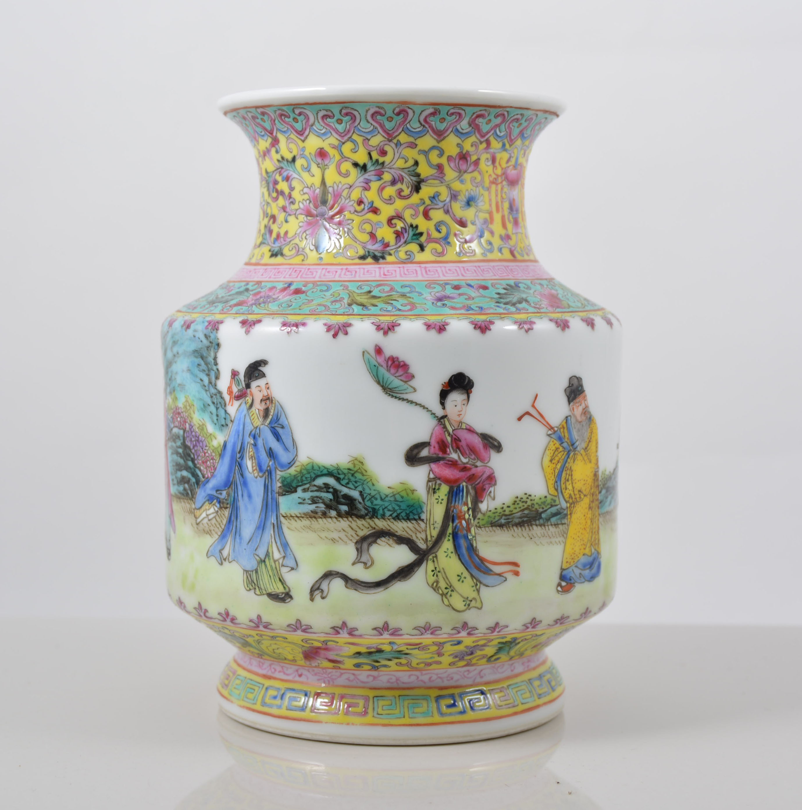 Chinese yellow ground vase, cylindrical section, painted with figures in a continuous landscape,