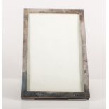 Silver mounted photograph frame, plain rectangular form, easel back, aperture 18cm x 11cm,