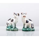 Pair of Staffordshire lead glazed earthenware models of seated cats, early 19th Century,