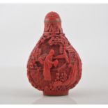 Chinese red lacquer snuff bottle, decorated with figures in a landscape, character mark to the base,