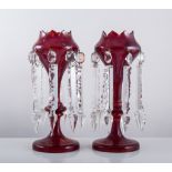 Pair of Victorian ruby glass lustres, traces of gilt, prismatic droplets, height 27cm.
