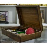 Wooden box containing two open face pocket watches, two 9ct gold sapphire rings, jet bead and links,