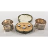 Part set of mother of pearl faced studs, two silver napkin rings, cufflinks, studs etc.