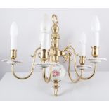 Brass and ceramic five light chandelier, with electric candle fitments, 35cm drop.