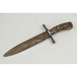 A Bowie knife, 19cm part serrated blade, stag horn two part handle.