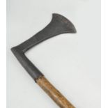 An executioners axe, 17th century style, stained wood shaft, overall length approximately 125cms.