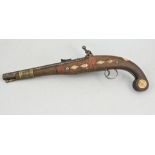 Arab flintlock pistol, inlaid stock, engraved action, overall length 46cms.