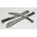 A pair of machete, blades stamped Legitimus, Collins & Co, USA, stained composition sectional grips,