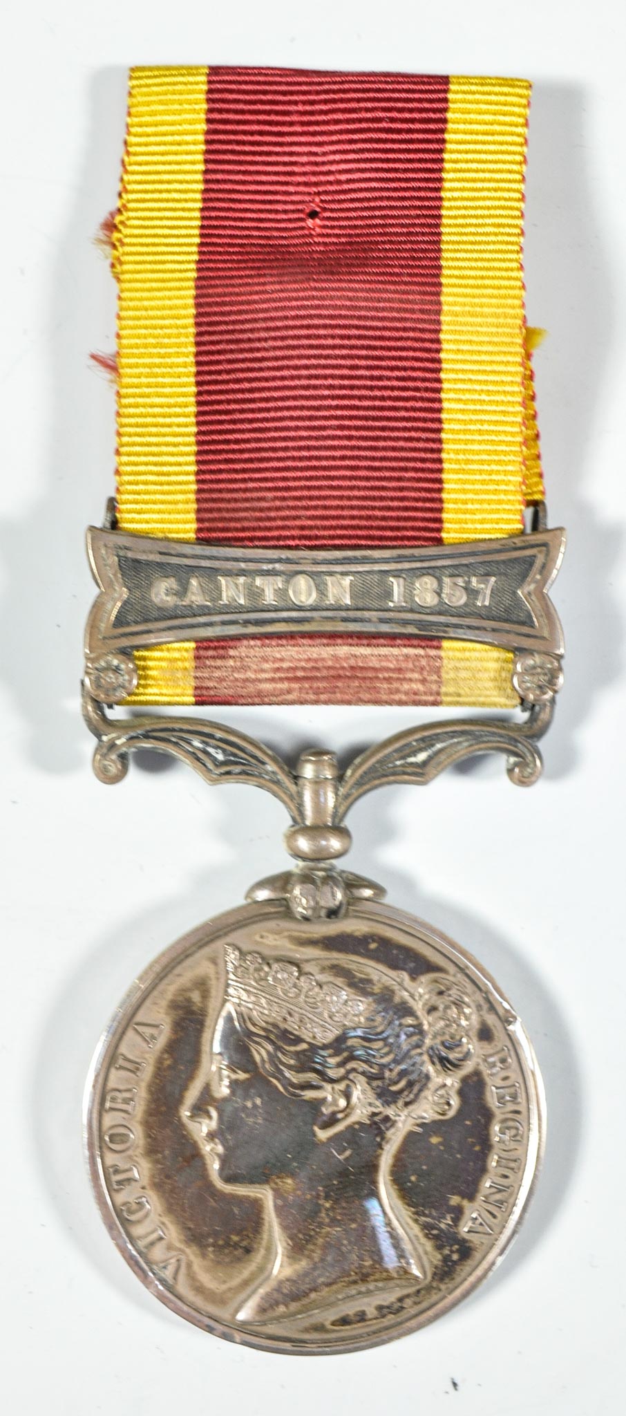 Victorian II China War medal, unnamed, one bar Canton 1857 with ribbon.