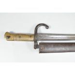 A Martini-Henry pattern 1860 Yataghan sword bayonet, with original metal scabbard,