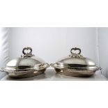 A pair of Regiment silver plated entree dishes, oval form with domed lids,