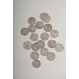 A small collection of tree pence coins, mostly silver, George V and George IV.