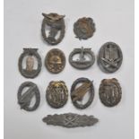 A collection of German WWII uniform badges, numbers, buckles and banknotes, (quantity).