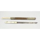 A Japanese trousse, comprising knife, ivory grip, two bone chopsticks, wire and metal bound case,