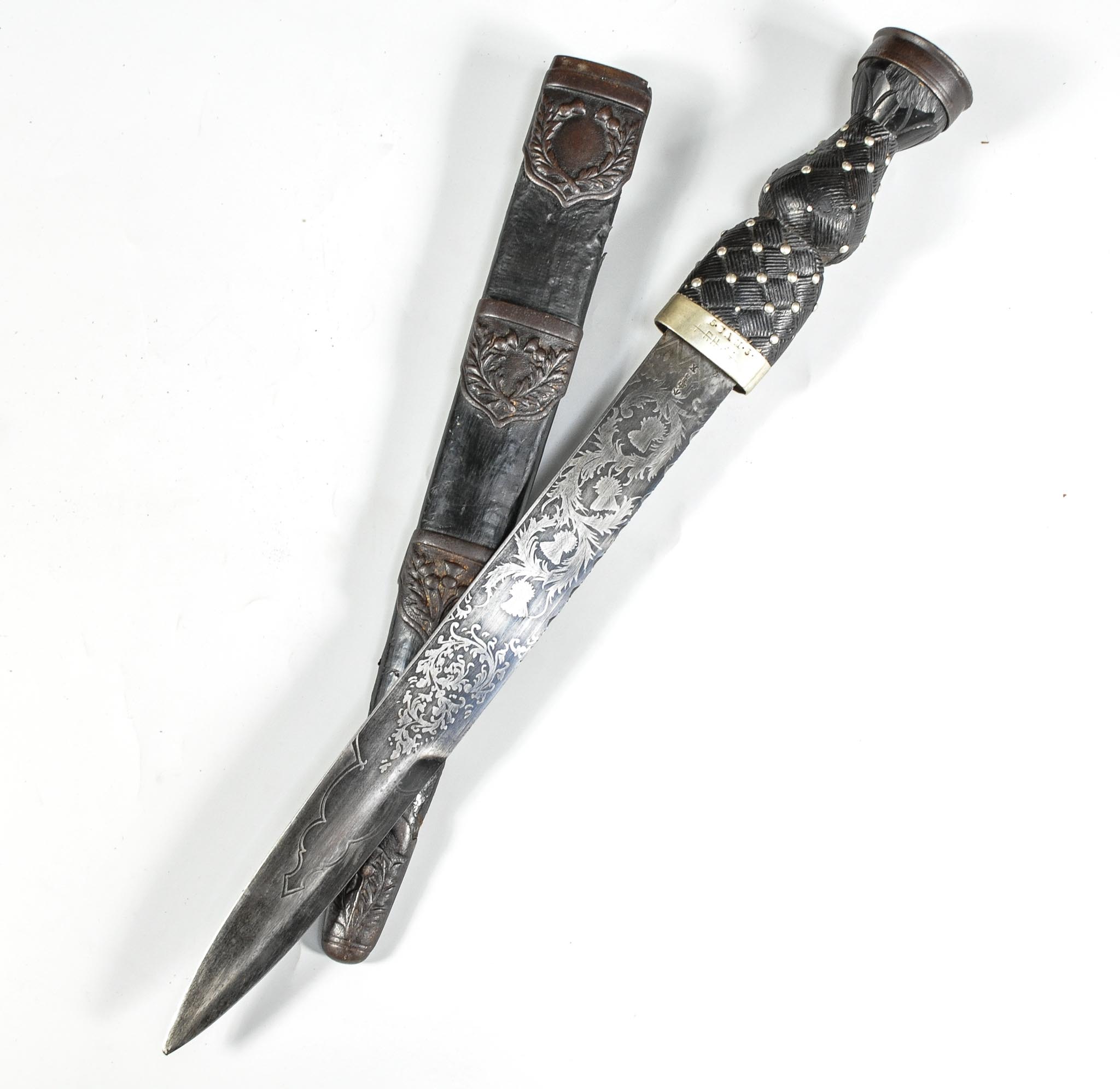 Scottish Military Dirk, the pommel with metal cap and Crown, leather bound studded grip,
