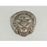 A cast silver plated paperweight, designed as a lion mask, engraved "Badge of H.M.S.