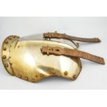 A Life Guards Regiment metal breastplate, with two leather backed straps, length 46cms.