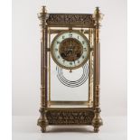 Edwardian brass cased "Four glass" mantel clock, case with a cast frieze, fluted columns,