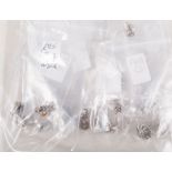 Nineteen pairs of silver ear studs for pierced ears, some stone set.