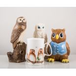 Collection of owl themed models and novelties.
