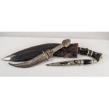 An Eastern Kukri knife, curved blade, in a steel sheaf, other Eastern knives, sword, etc.