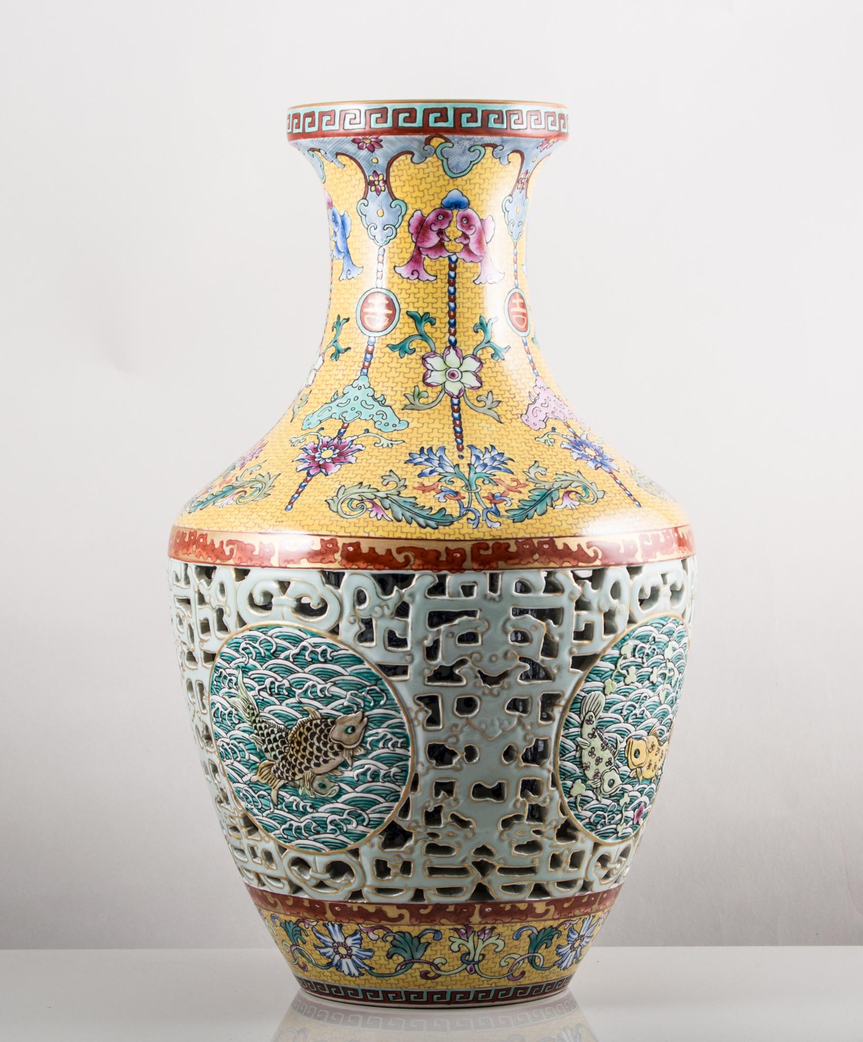 Chinese polychrome reticulated vase, bearing six character seal mark,