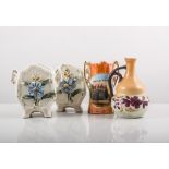 Pair of Japanese porcelain bottle vases, decorated with birds and flowers, on a shaped blue ground,