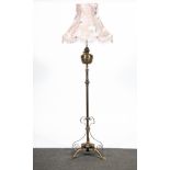 English, an Arts and Crafts brass standard oil lamp, adapted for electricity,