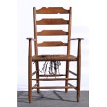 An Arts and Crafts ash and rush ladderback armchair, height 105.