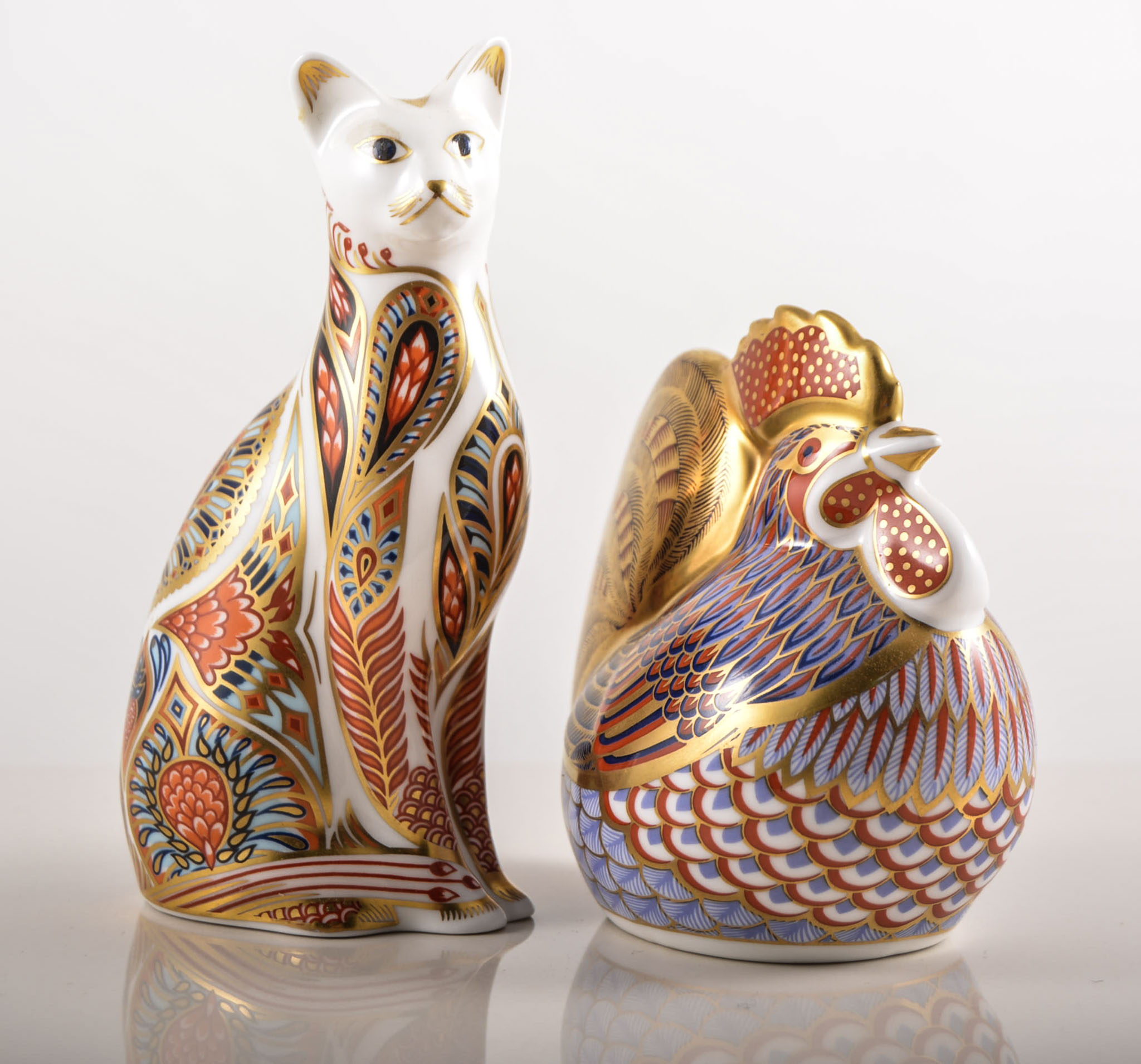 Royal Crown Derby Imari pattern animal paperweight, modelled as a cat, seated, height 13.